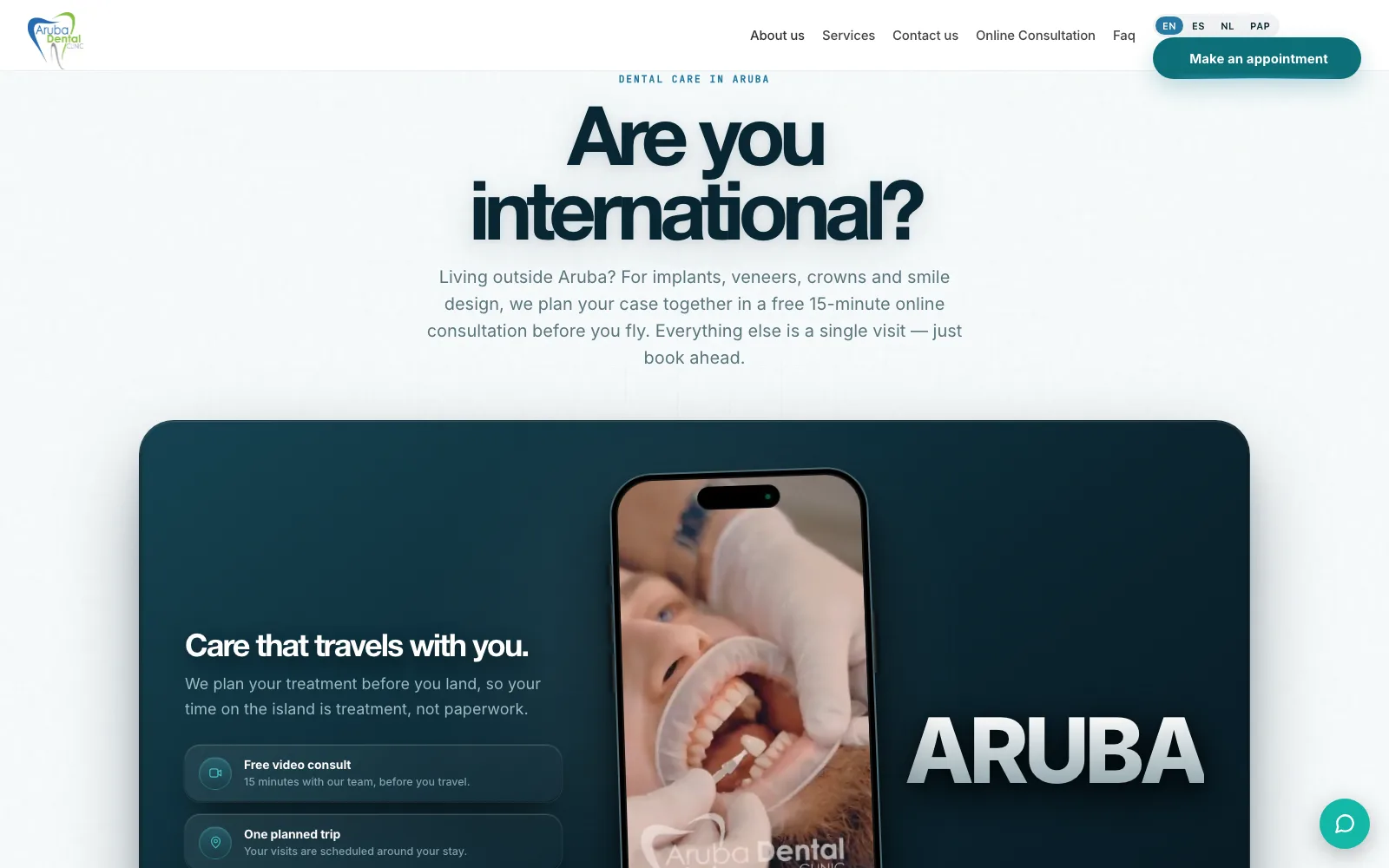 Aruba Dental Clinic's international section with a phone playing a treatment video.